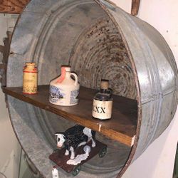 Country shelf made out of Old watering pan