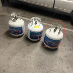 3 Propane Tanks One Is Half Way Full