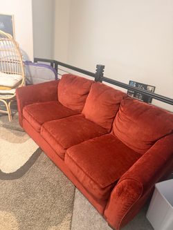 Rust colored couch and love seat
