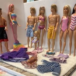 8 Barbie Dolls & Outfits