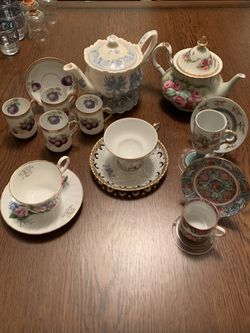 Tea pots, cups and saucers.