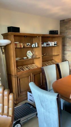 Lite bookcase with storage below … 2 pieces joined each 42” x 72.5 “ tall by 16-18” deep . Has a slanted book case shelf. Wood shelf and a glass she