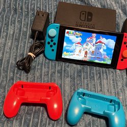 Nintendo switch with Mario rabbids game, docking station, joycon grips hdmi and charger  No Trades Cash Only 