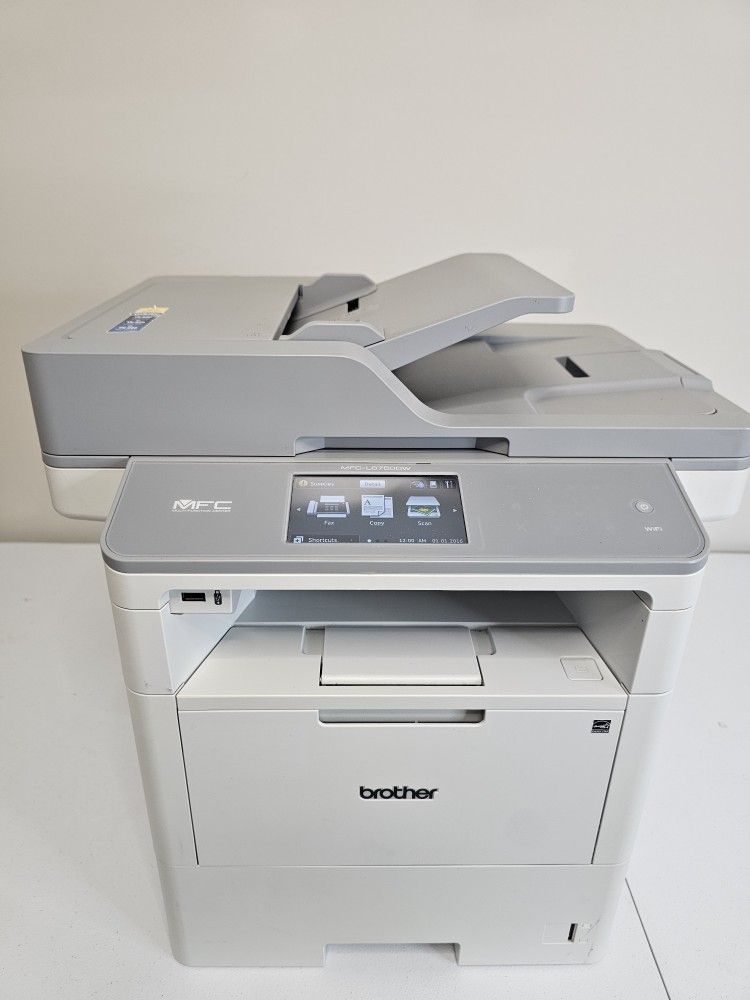 Brother MFC-L6750DW multifunction laser printer, fully operational.