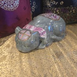 Unusual sleeping cat figurine