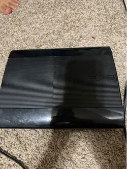 PS3 w/ controllers and charging station