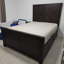 Queen-size wooden bed frame, purchased at Ashley Furniture
