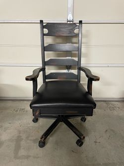 Black ladder back chair and vintage trunk/chest