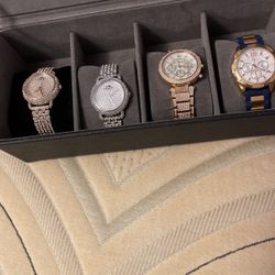 two of the watches are michael kors and two are coach