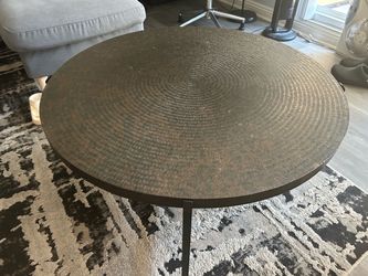 Round hammered metal coffee table