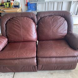Reclining burgundy couch and loveseat set