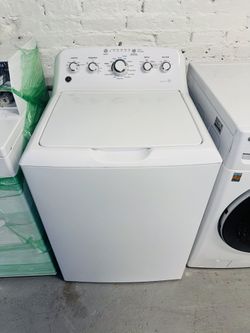 GE white washing machine, includes a receipt with a 60-day warranty.