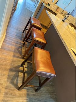 3 brown faux leather bar stools used