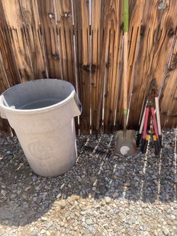 Garden tools and trash can