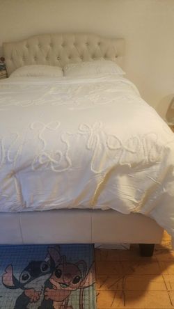 Full size bed with diamonds on headboard