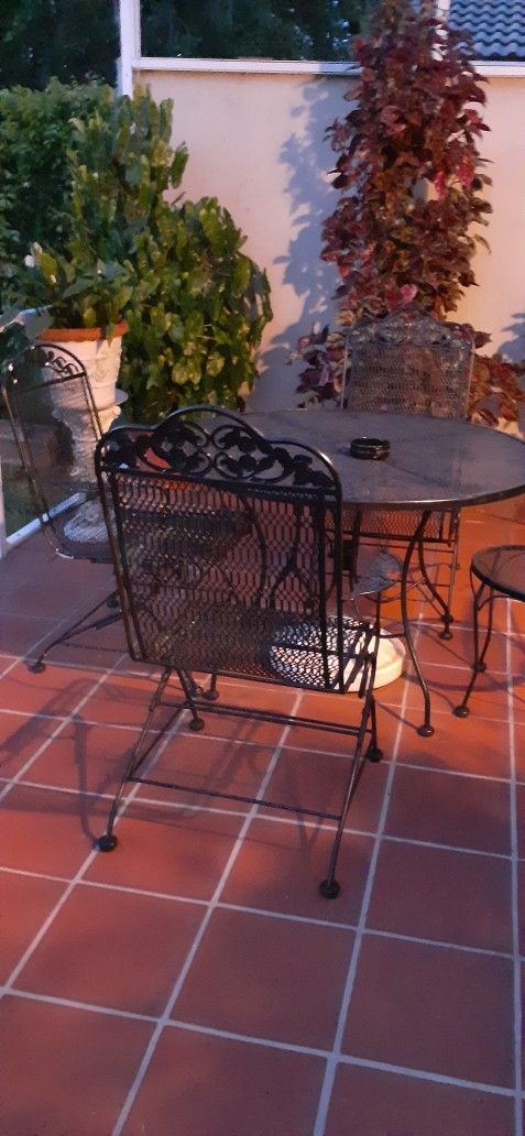 Wroth Iron Table and 3 Chairs , Chairs Bounce, Very Comfortable