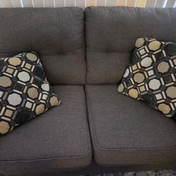 two sets of couches big and small