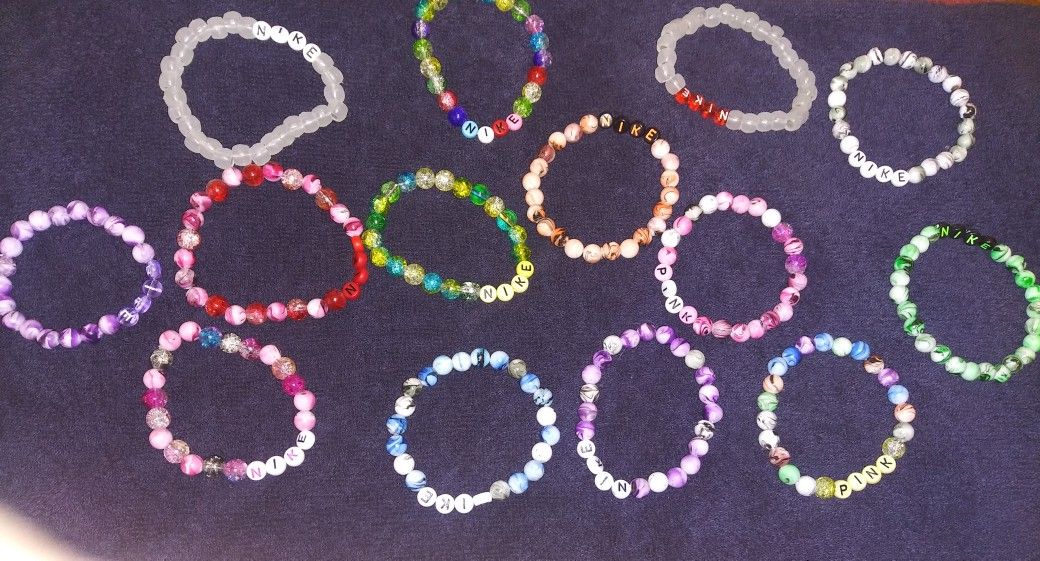 Nike. Pink. Bracelets