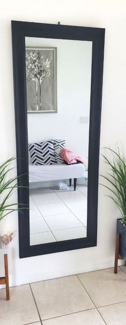 Elegant black framed mirror, perfect for any room.