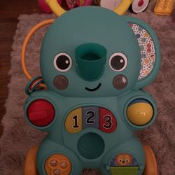 Bright Starts Stroll 'n Roll - Andador de bola 2 en 1, incluye 3 bolas de juguete, elefante con más de 70 canciones y sonidos, 7 actividades, lanzamie