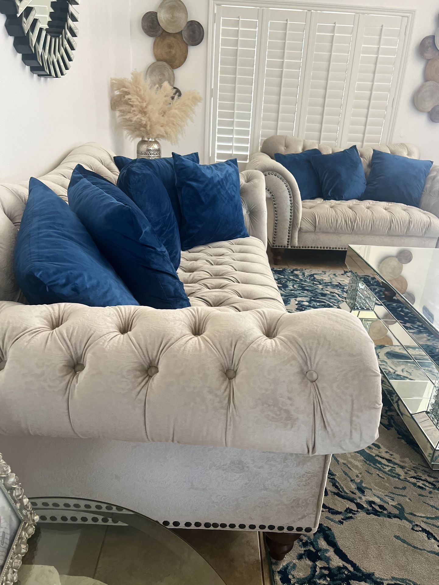 Couches And Love Seat With Coffee Table And Wall Mirror