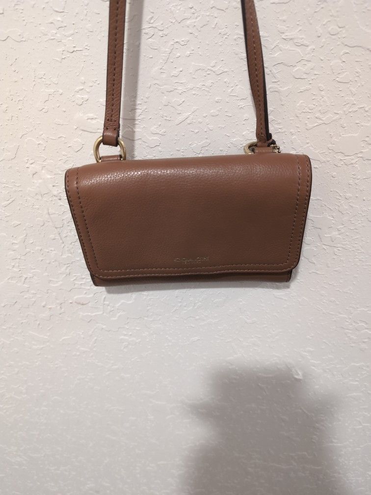 AUTHENTIC COACH SLING WALLET NOW $25.