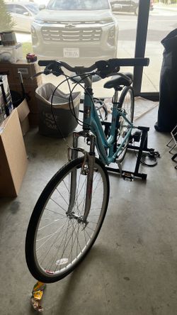 Bike with station bicycle trainer stand