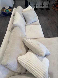 Medium firm couch with fluffy pillows