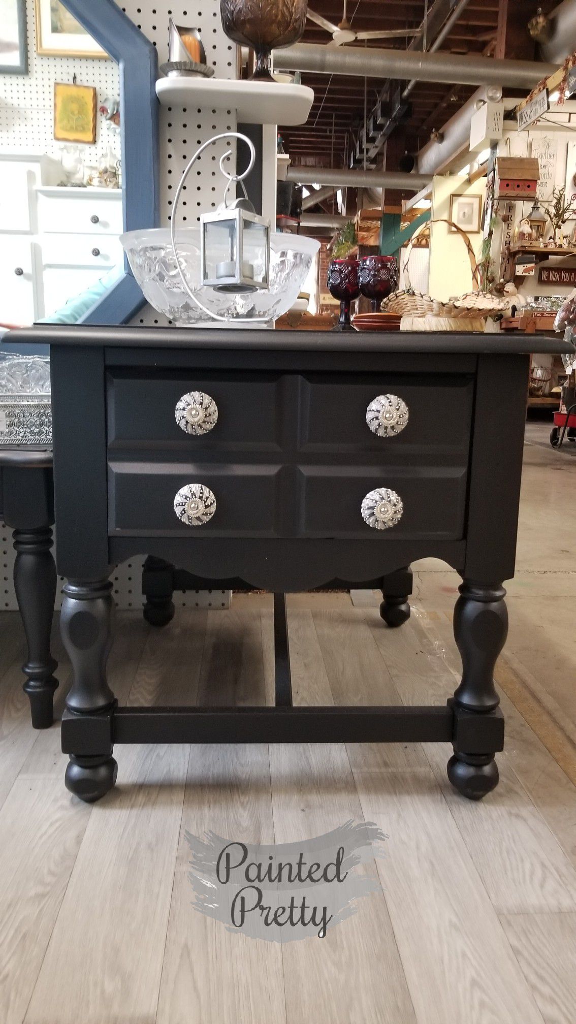 Black end table with decorative drawer pulls