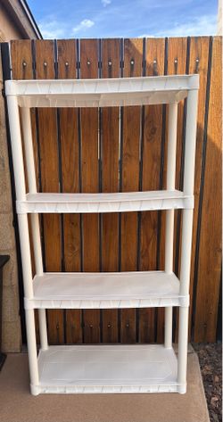 $15 - PLANO 4 Shelf plastic shelving unit. Used indoors for crafts. Measures 30”w x 55”t x 14.25d. Tall. Comes apart for easy transport. Please