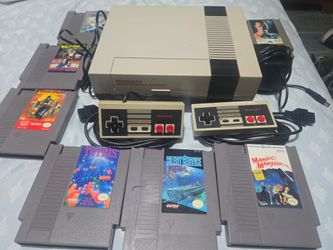 NES with 7 games and 2 controllers