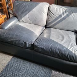 Black Leather Love Seat And Matching Chair.