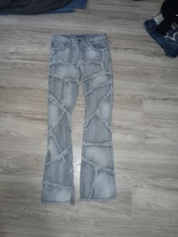 Taker Distressed Stacked Flare Jeans