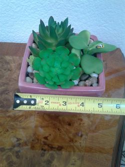 Artificial flowers in pot. $5 each