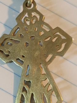 14 karat gold cross 8.7 g with a 14 karat gold plated rope chain with lobster clamp