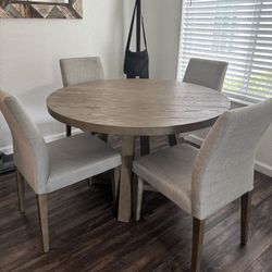 Round Dining Table with Upholstered Chairs