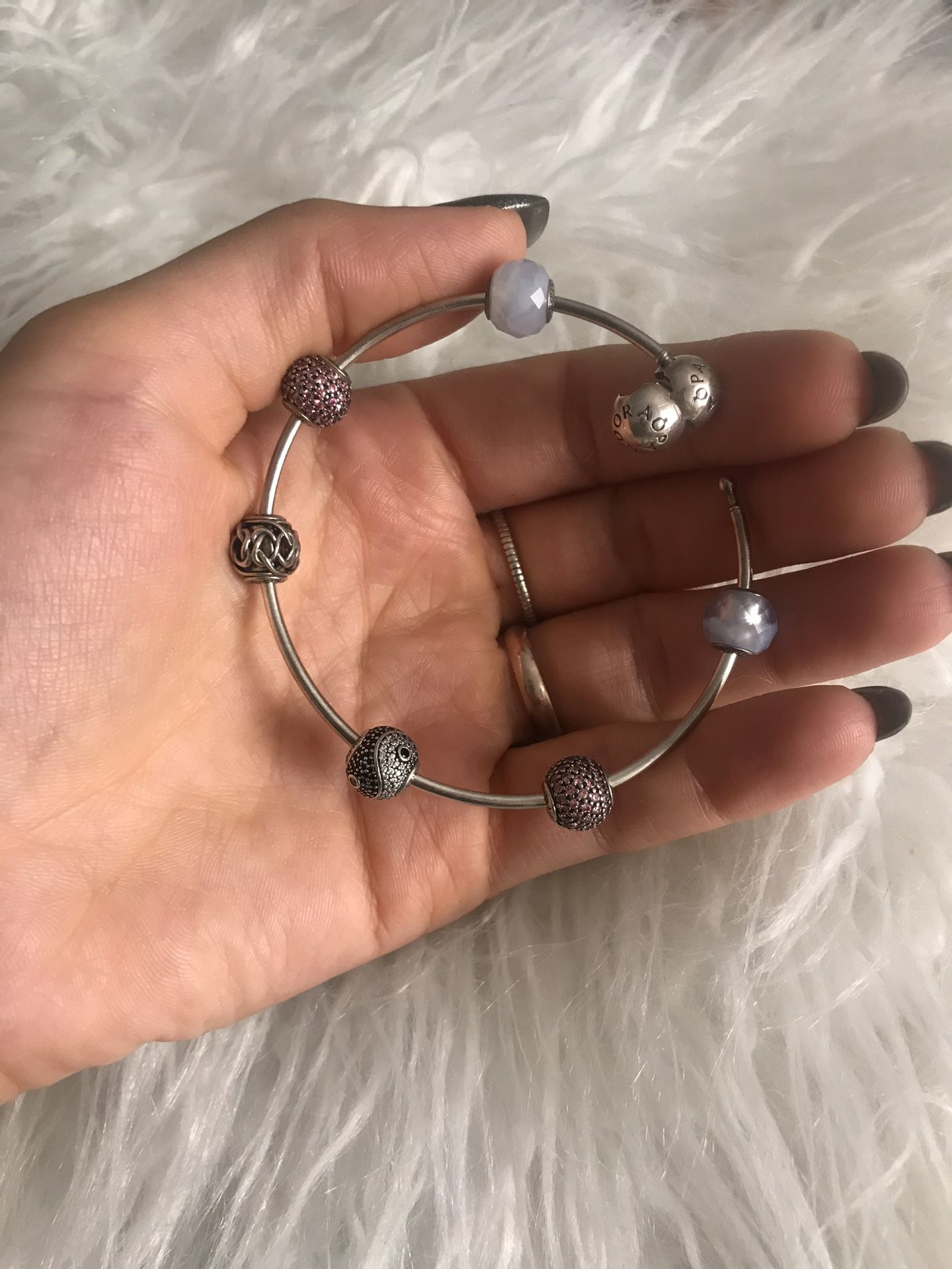 Pandora bracelet with 6 charms . In a perfect condition. Selling the charms separate too . The total is over $150 , selling it for $75 , or your best