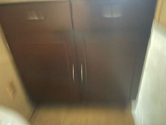 Dark Wood Kitchen Cabinet with Metal Top