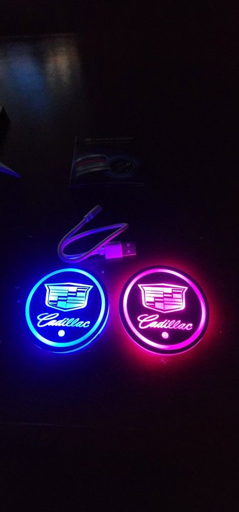 2 Cadillac Led Color Changing USB Car Cupholder Coasters.  Cadillac Door Projector Lights,  Seatbbelt Pads .  SHIPPING AVAILABLE
