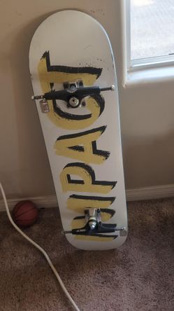 Skateboard Deck plus hardware, trucks, and bearings