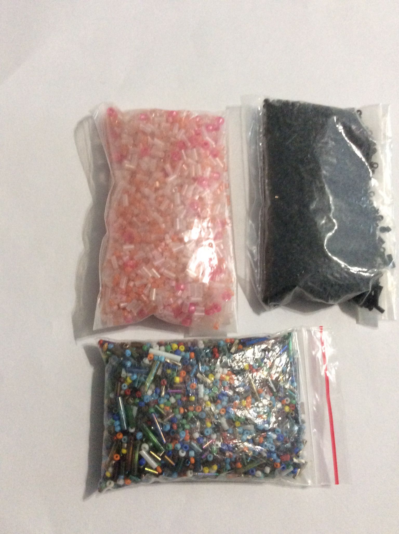 Selling 3 bags of Multi-colored/Multi/size Seed Beads for Crafting and Creating jewelry or where ever your imagination takes you. The beads are multi-