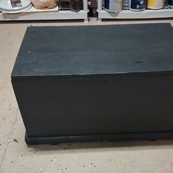 Antique black-painted wooden chest, likely a 19th-century pine blanket chest or shipwright's Trunk