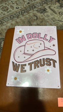 Metal sign in Dolly we trust still wrapped