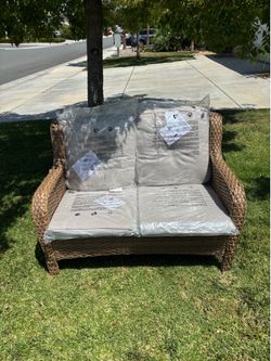 2 seater love seat outdoor patio furniture couch grey cushions and brown wicker frame