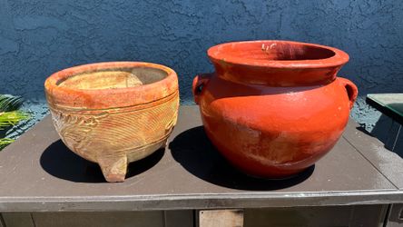 2 clay pots for plants. Both about 12” openings.