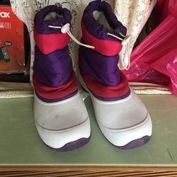 Two pairs of snow boots one pair is size five and the other is size six $6