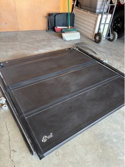 Hard tunnel bed cover for four-door Chevy Silverado or GMC