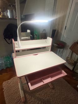 Pink desk with pink rug together