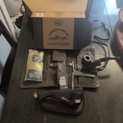 2 brand new pipes with 2 carrying pouches and cleaner tool.