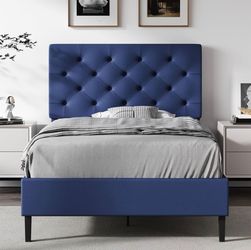 Twin Faux Leather Bed Frame with Headboard, Navy Blue
Upholstered platform bed with wooden slat support, no box spring needed.